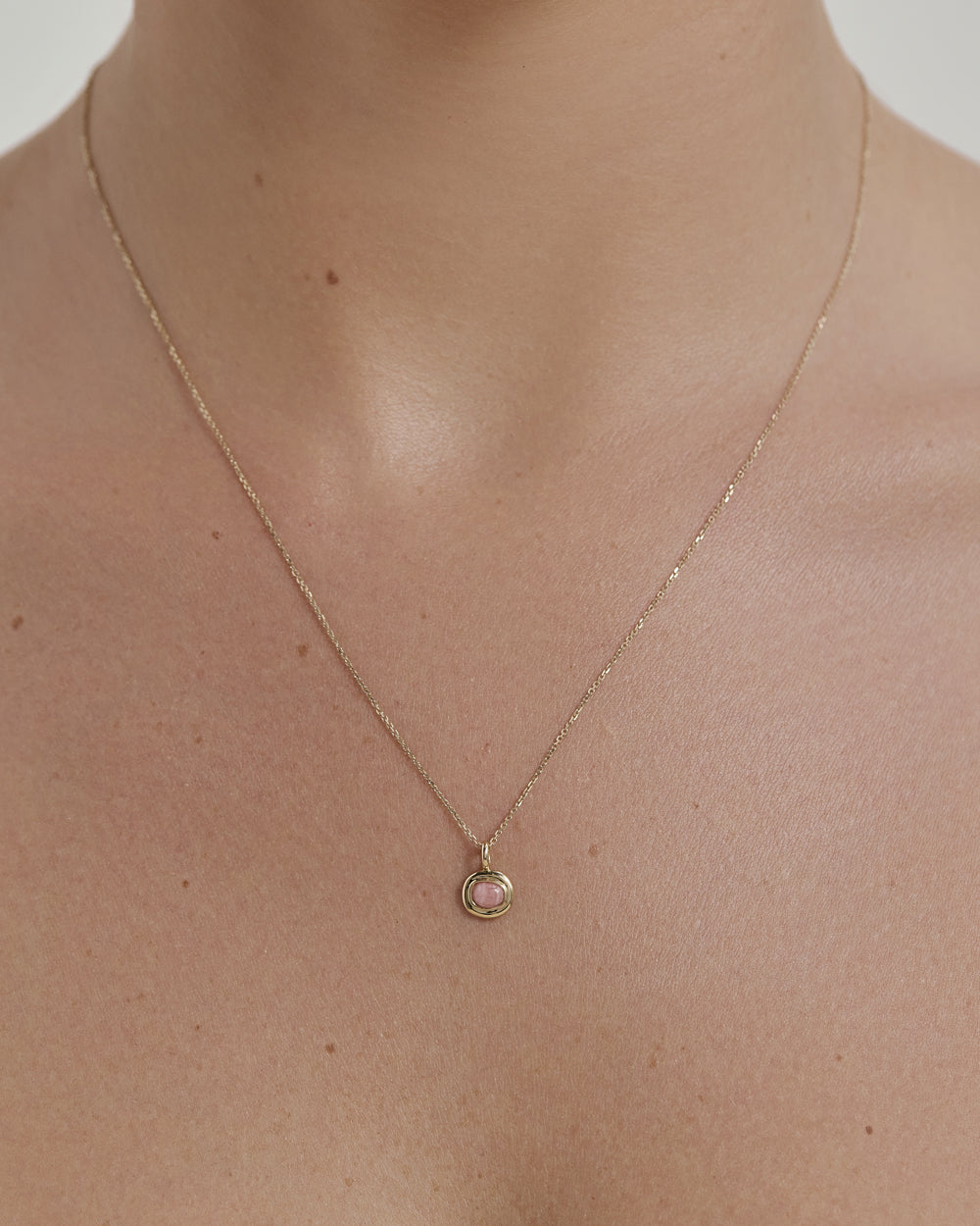 INTO THE FLOW RHODOCHROSITE CHARM (9K GOLD)